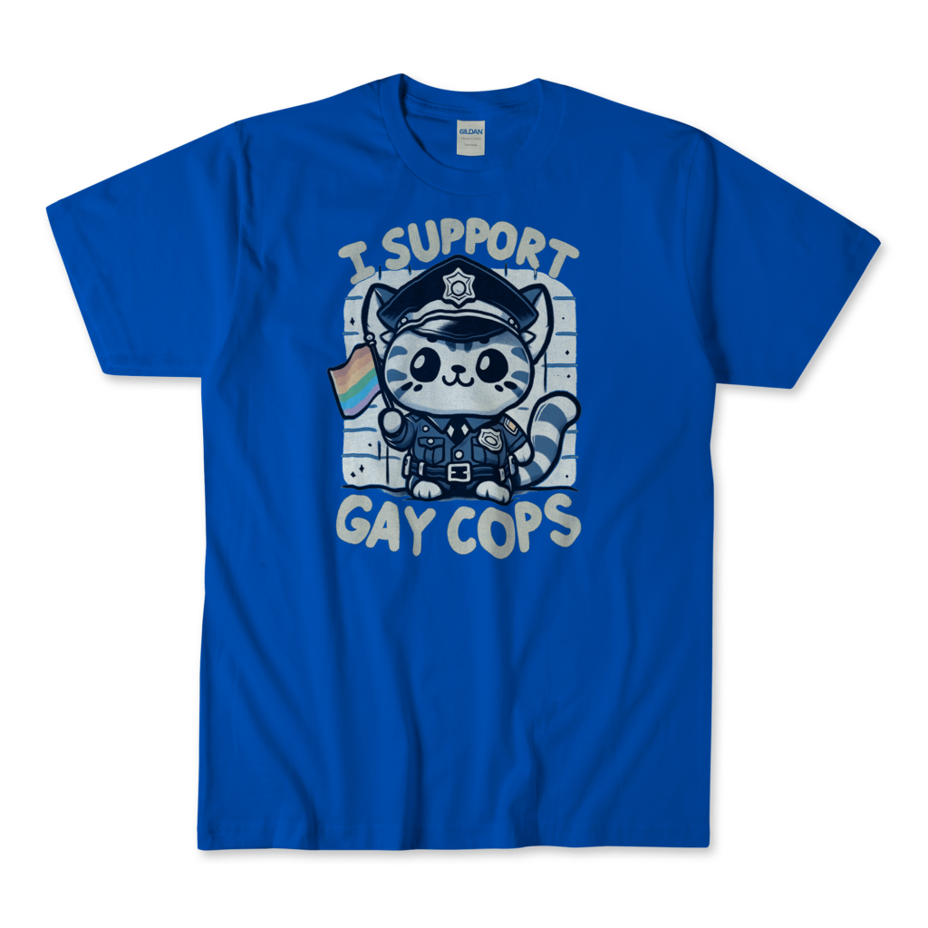 A royal blue T-shirt featuring a cute kitten dressed in a police uniform, holding a rainbow flag. The kitten has a friendly and supportive expression. The text "I support gay cops" is displayed in a bold, playful font above and below the kitten. The background is simple and clean, allowing the main elements to stand out prominently. By Left Arrow Tees Company.