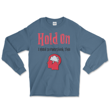 mens-long-sleeve-shirt-indigo-blue-front-6674291a55927.png An indigo blue long sleeve shirt featuring a humorous design. The shirt displays the text "Hold On I Need to Overthink This" in a distressed red and black font. Below the text, there is an illustration of a red head profile with a cloud and a lightning bolt inside, representing overthinking. Left Arrow Tees company.