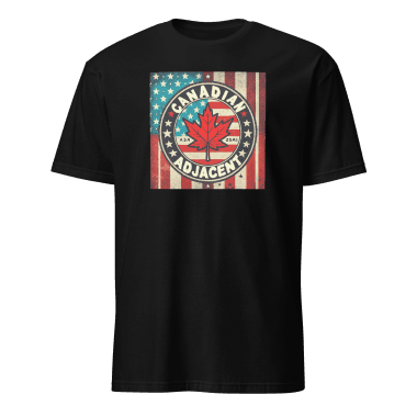 Black T-shirt featuring a bold, vintage-style graphic design with the text 'Canadian Adjacent' encircling a maple leaf set against a backdrop of an American flag. The distressed look adds character, making it a fun and stylish choice for celebrating cross-border love and humor. Left Arrow Tees, affordable graphic tees.