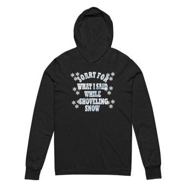 A charcoal black hoodie tee featuring the humorous quote "Sorry for What I Said While Shoveling Snow" surrounded by snowflake graphics. Perfect for winter enthusiasts, snow shovelers, or anyone with a love-hate relationship with snowy days. Left Arrow Tees affordable graphic tees.