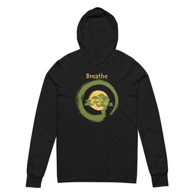 unisex-hooded-long-sleeve-tee-black-front-6754dfb2a8d05.jpg A black hoodie tee featuring a serene design with the word "Breathe" in soft yellow above a Japanese-inspired bonsai tree framed by a green enzo circle. The tranquil imagery reflects mindfulness and balance, making it perfect for meditation or yoga enthusiasts. This hoodie is part of the stylish collection from Left Arrow Tees, the place for affordable graphic tees that inspire and delight.