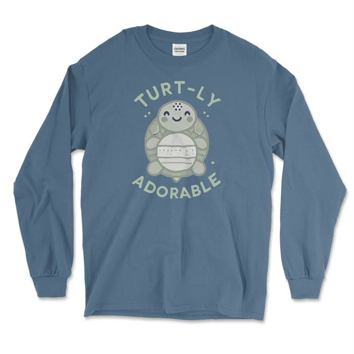 Indigo Blue long-sleeve graphic tee featuring an adorable cartoon turtle design with the phrase 'Turt-ly Adorable' in light green. Perfect for turtle lovers and those looking for unique turtle-themed gifts. Find this and other affordable graphic tees at Left Arrow Tees.