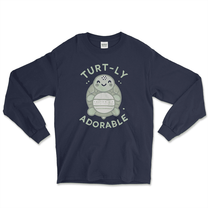 Navy long-sleeve graphic tee featuring an adorable cartoon turtle design with the phrase 'Turt-ly Adorable' in light green. Perfect for turtle lovers and those looking for unique turtle-themed gifts. Find this and other affordable graphic tees at Left Arrow Tees.